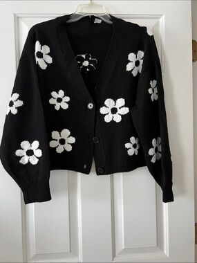 Divided Black Cardigan Sweater with White Floral Motif